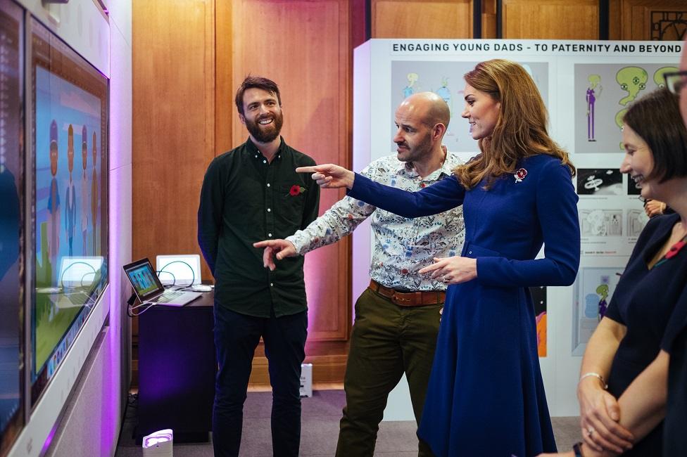 Kate speaking and pointing to an animation created as part of Tiny Happy People