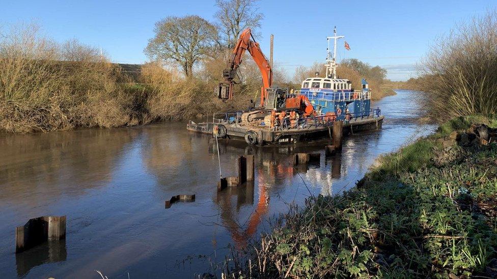 Specialist boat at work on the river Aire