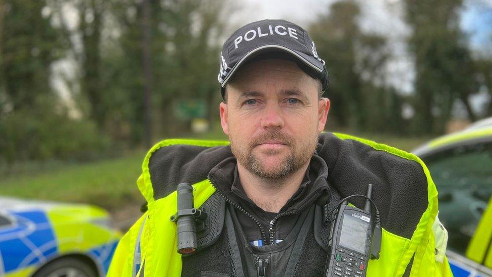 A police officer in a hi-vis jacket