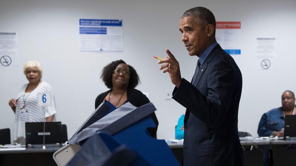 During an unannounced visit, Obama stood before a voting machine at the Chicago Board of Elections office, punched in his choice and smirked when asked who he had voted for, October 7, 2016.