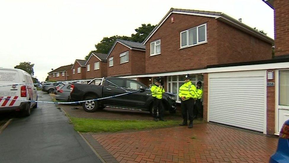 Police tape sealing a house off