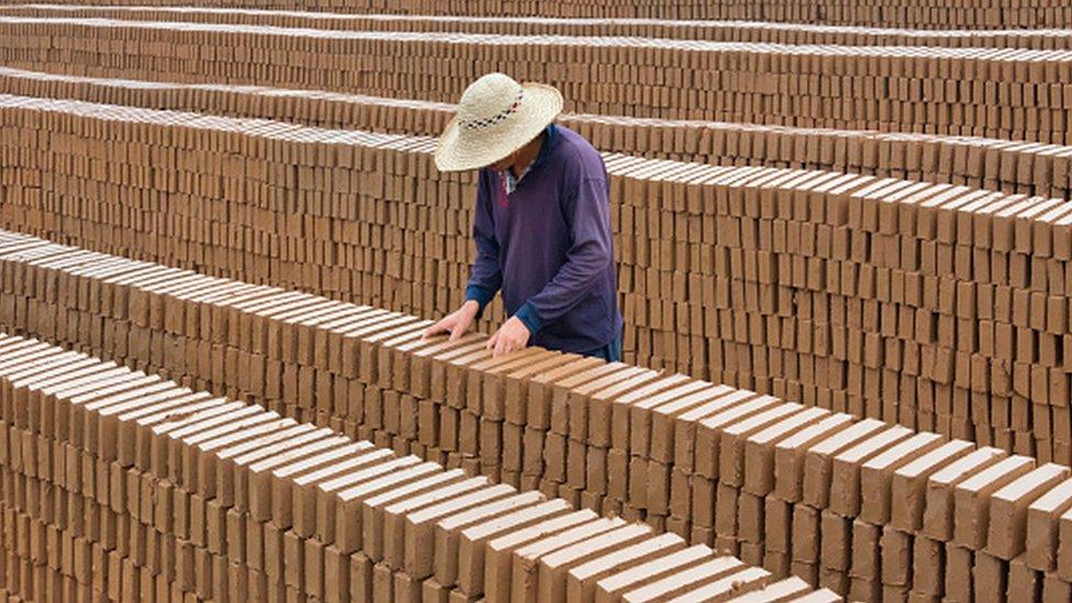 A man at a brick factory in China