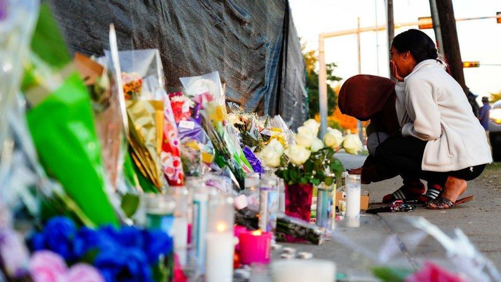 Visitors look at the memorial outside of the canceled Astroworld festival at NRG Park on November 7, 2021 in Houston, Texas