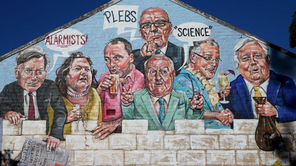 The mural depicting (L-R) newspaper columnist Andrew Bolt, mining magnate Gina Rinehart, Deputy PM Barnaby Joyce, media mogul Rupert Murdoch, commentator Alan Jones, Prime Minister Scott Morrison, and former MP Clive Palmer