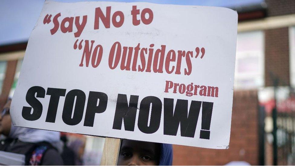 Protester holding banner