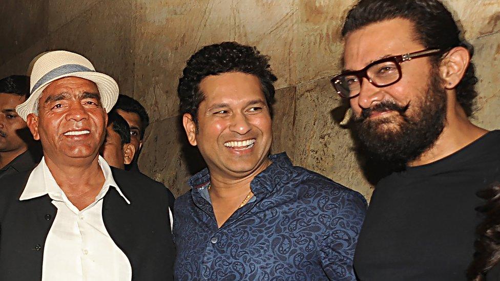 Indian amateur wrestler and Olympic coach, Mahavir Singh Phogat, (L), former Indian cricketer, Sachin Tendulkar (C) and Bollywood actor Aamir Khan attend the special screening of the biographical sports drama Hindi film 'Dangal',