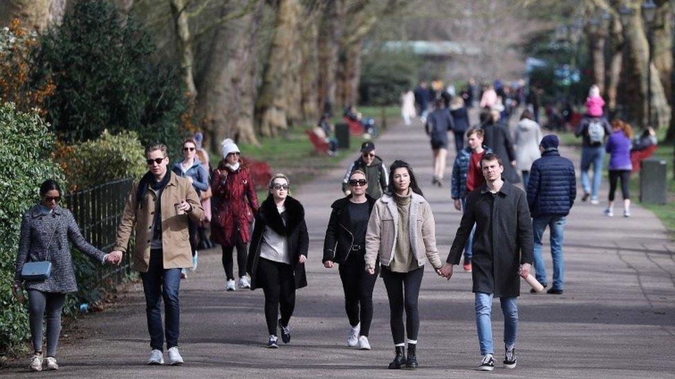 People walking through Battersea Park