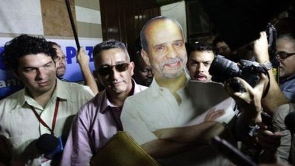 Farc delegate Ruben Zamora (centre, in sunglasses) carries a life-size cardboard cut-out of imprisoned guerrilla Simon Trinidad before talks in Havana, Cuba, 19 November 2012