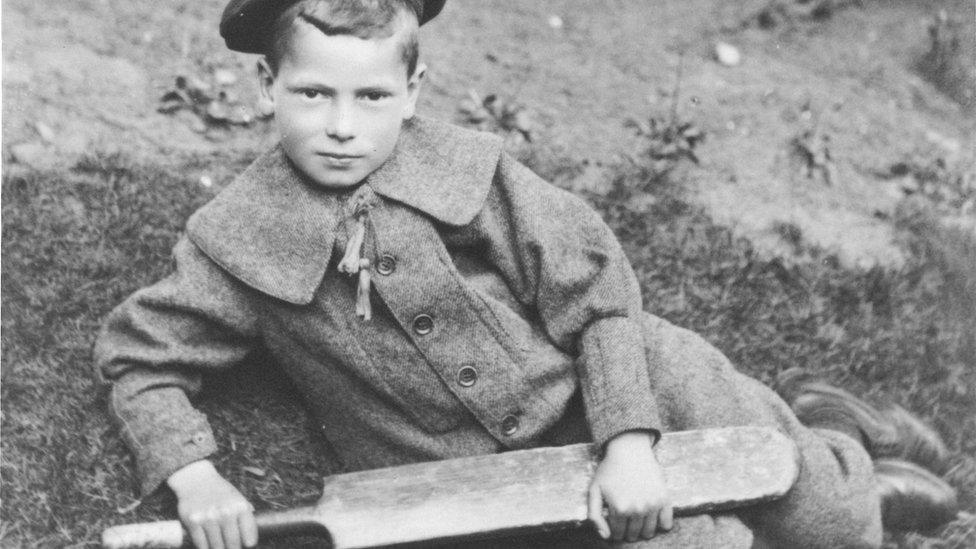 Boy at Birmingham with cricket bat