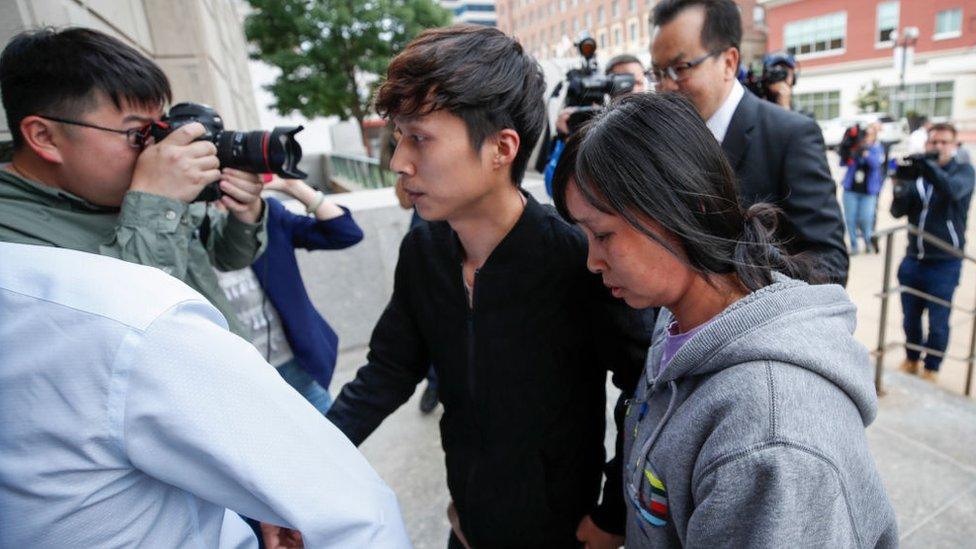 Mother Lifeng Ye (R) and brother Zhengyang Zhang (C) of Yingying Zhang arrive at the US Courthouse as federal trial of Brendt Christensen begins in the 2017 disappearance and suspected killing of Yingying Zhang, a visiting scholar from China whose body has not been found on June 12, 2019 in Peoria, Illinois.