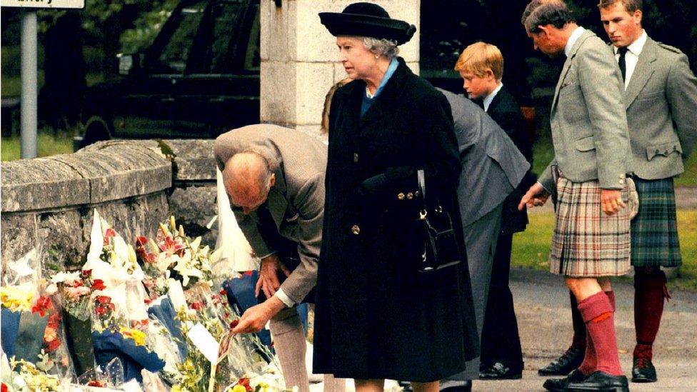 The Royal family looks at floral tributes left at Balmoral Castle for Princess Diana days after her death