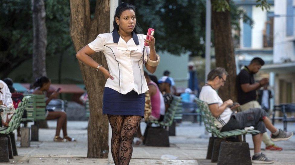 Cubans use a public Wi-Fi spot in Havana, 26 Nov 16