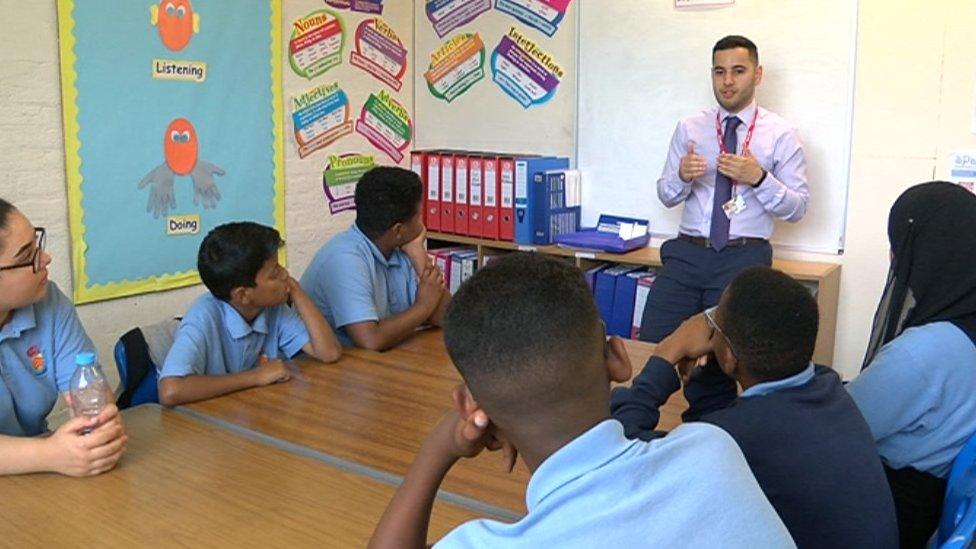 Hamed Amiri speaking to pupils