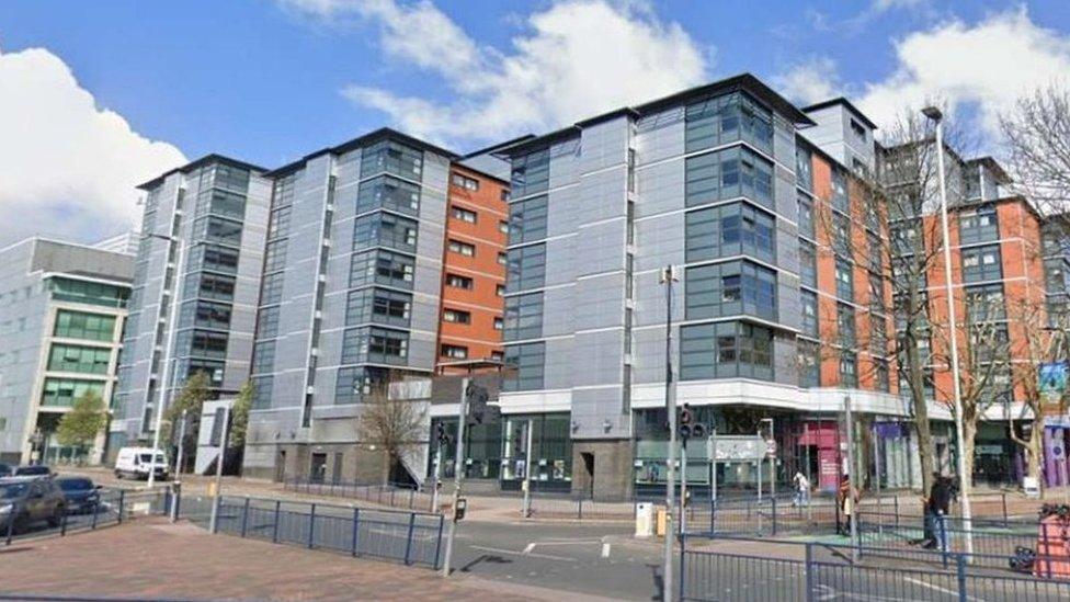 a block of grey and orange student flats