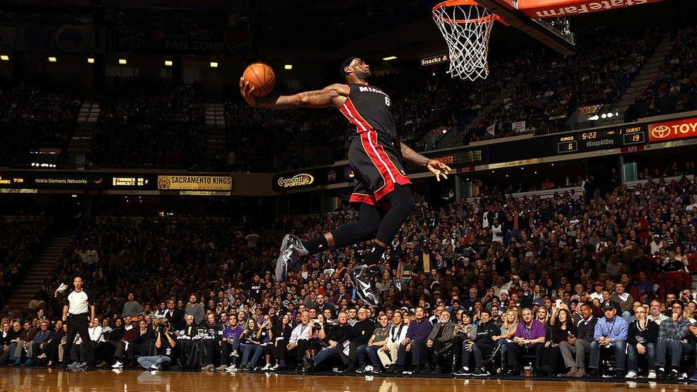 LeBron James about to dunk a basketball