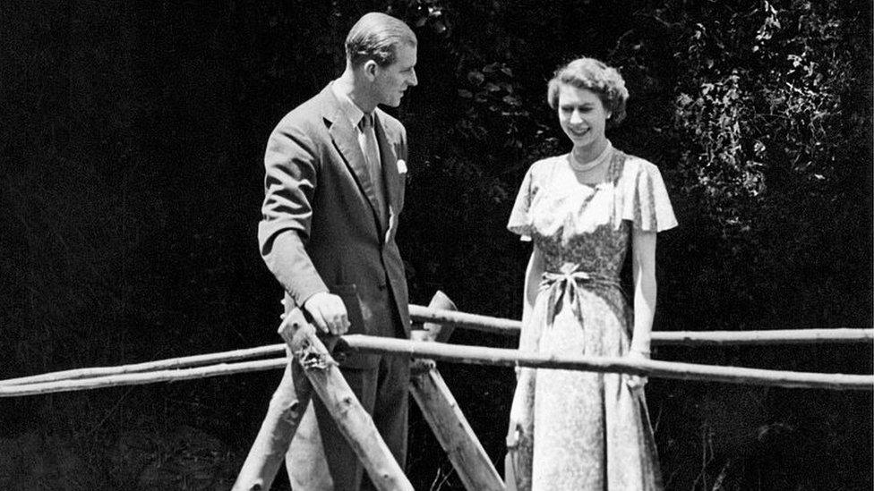 Princess Elizabeth and the Duke of Edinburgh on a bridge in the grounds of Sagana Lodge