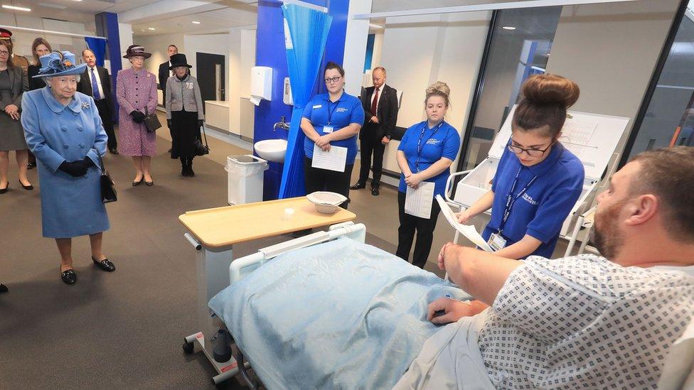 Queen watching a medical training exercise