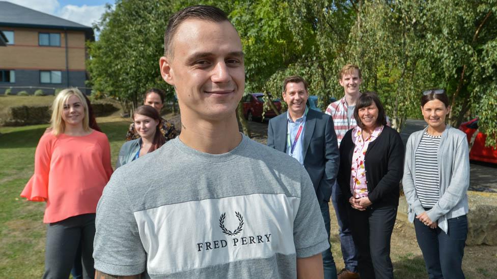 Byron Schofield with clinical and support staff at the Disabilities Trust