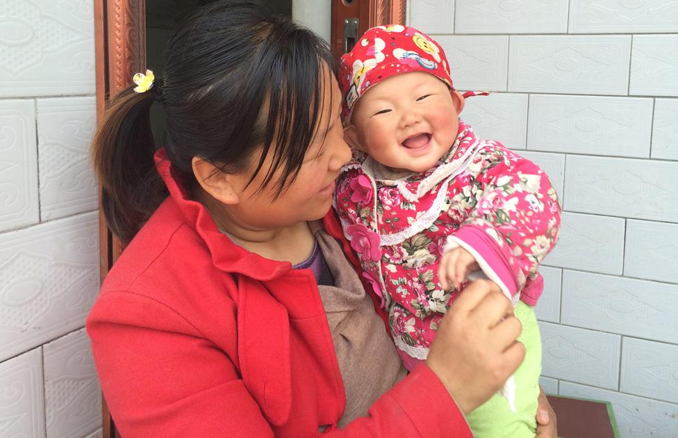 A mother and baby outside the parenting centre in Shaanxi Province