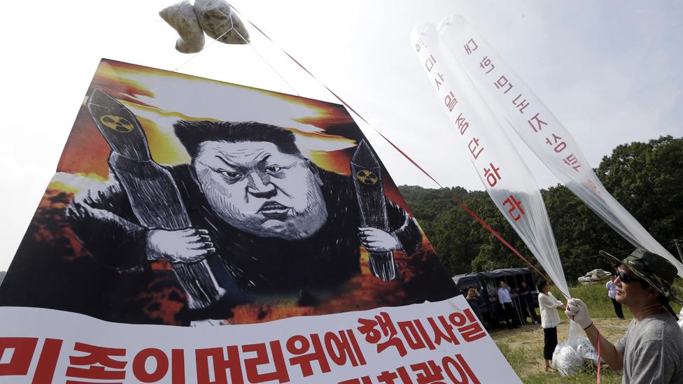 In this Thursday, Sept. 15, 2016, file photo, North Korean defectors prepare to release balloons carrying leaflets and a banner denouncing North Korean leader Kim Jong Un for North Korea"s latest nuclear test, in Paju, near the border with North Korea, South Korea