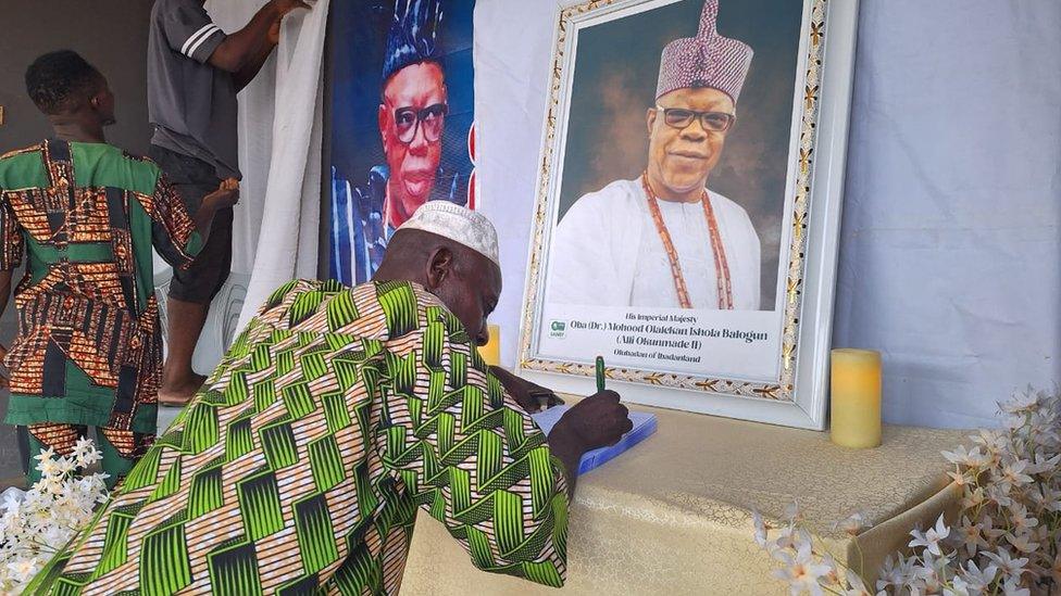 People prepare for Oba Moshood Olalekan Balogun's burial.