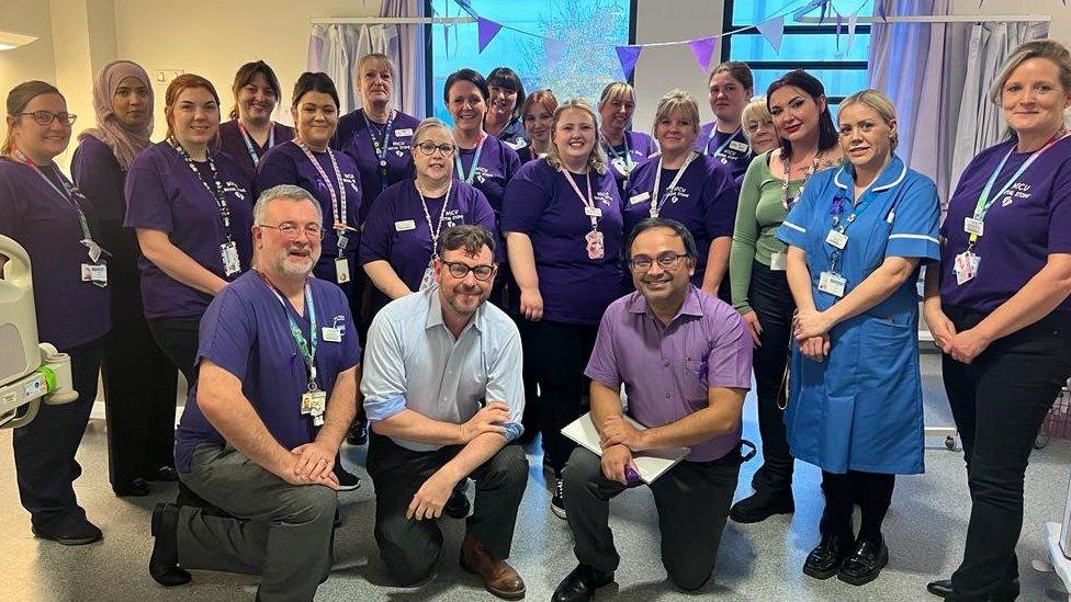 Staff gather for the reopening of the transitional care unit at the Royal Stoke University Hospital