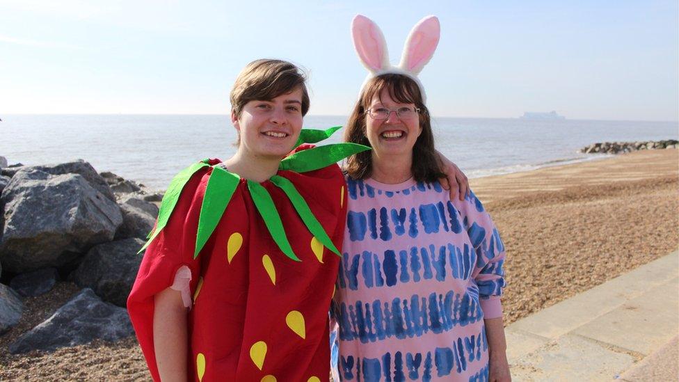 People dressed in a strawberry outfit and a bunny costume for the Felixstowe dip