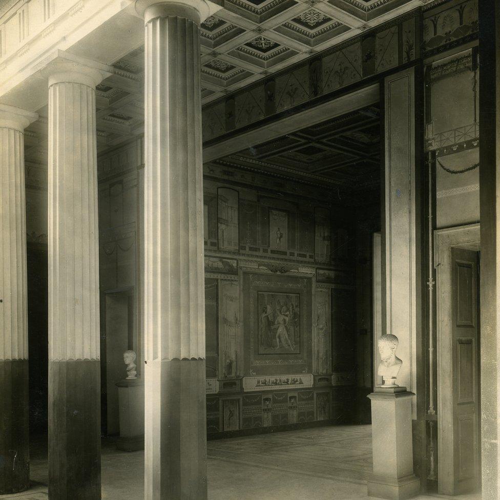 Old photo of bust on display