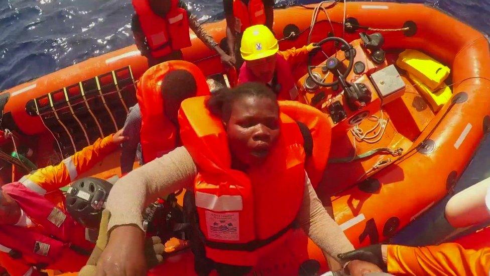 A pregnant migrant is brought on board a Save the Children vessel