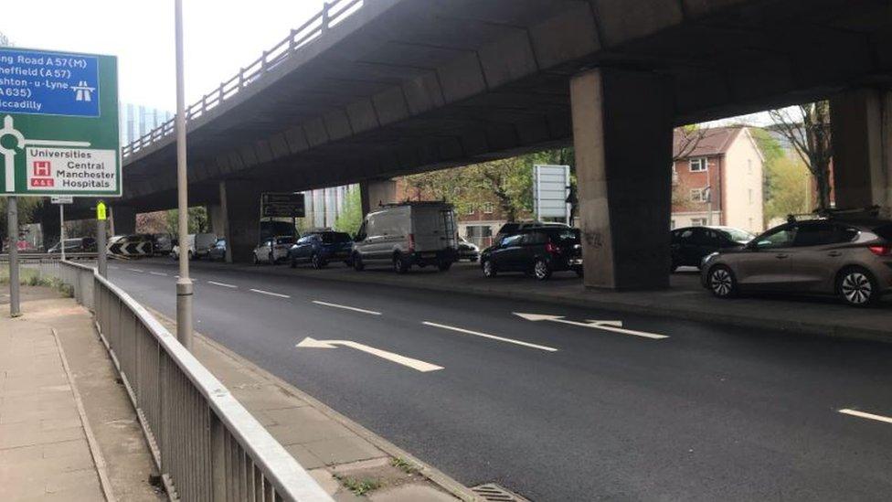 Cars parked under bridge