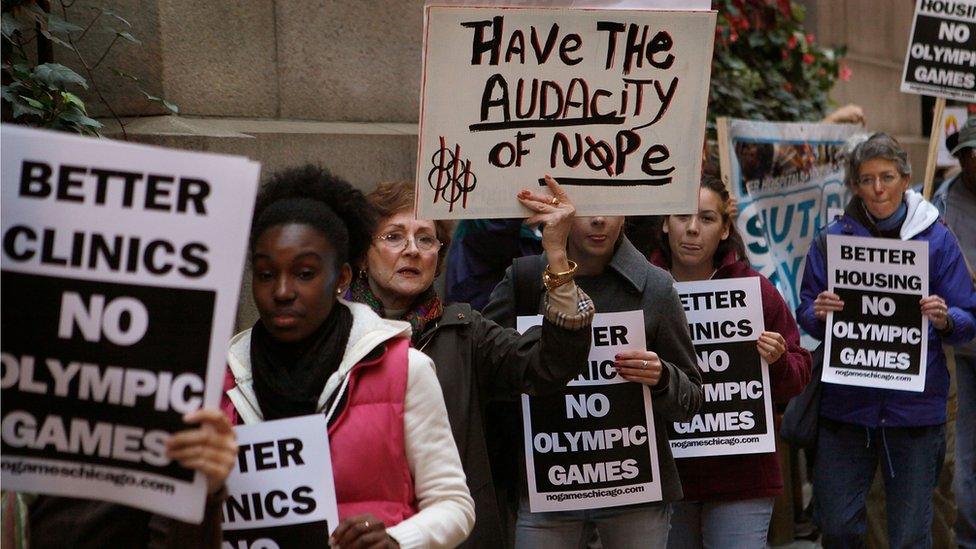 Demonstrators protest outside City Hall against Chicago's bid to host the 2016 Olympics