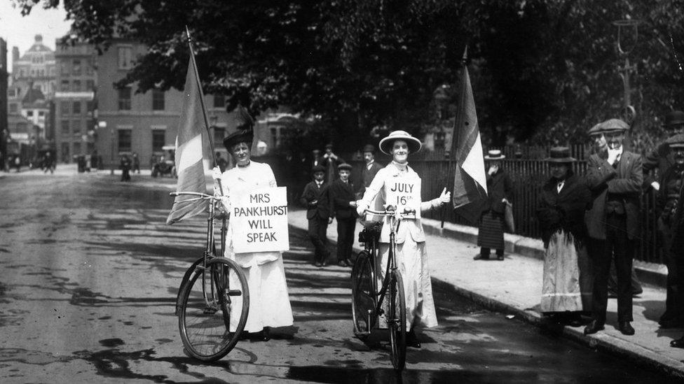 13th July 1914: Two suffragettes advertising a meeting at which Emmeline Pankhurst (1858 - 1928) will speak