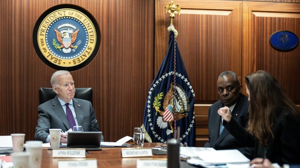 President Biden speaks with advisers in the situation room