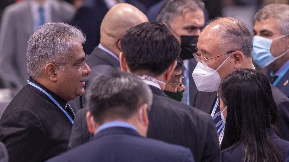 Members of the India and China delegations at the plenary session on the last day of COP26