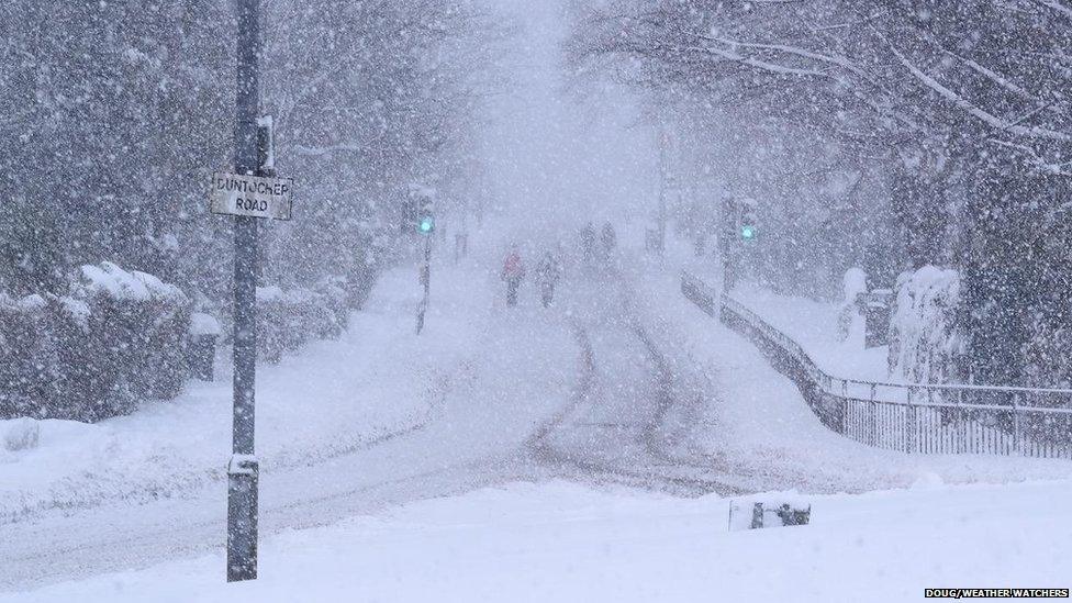 Snow showers by a road