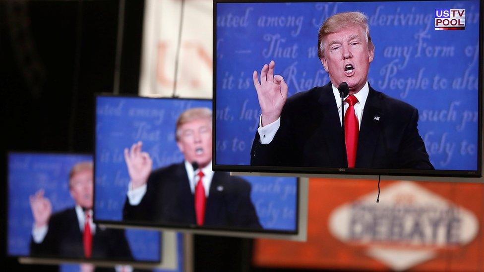 Republican U.S. presidential nominee Donald Trump is shown on TV monitors in the media filing room on the campus of University of Nevada, Las Vegas, during the last 2016 U.S. presidential debate in Las Vegas, U.S., October 19, 2016.