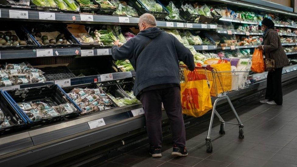 Shoppers in a supermarket in the UK