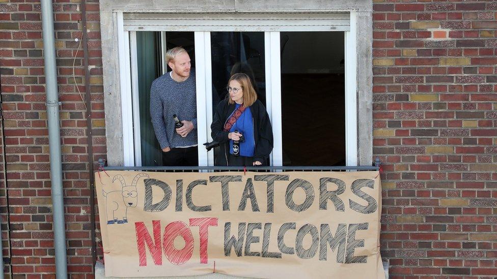 A placard on a balcony reads "Dictators not welcome", near the DITIB Central Mosque in Cologne, Germany on 29 September 2018.