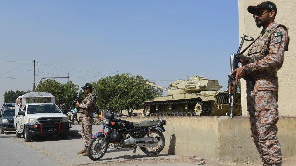 Paramilitary rangers stand guard outside Malir garrison ahead of the funeral of former Pakistani president Pervez Musharraf, in Karachi on February 7, 2023