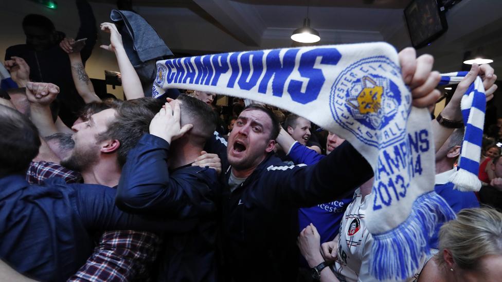 Leicester fans celebrate in a pub