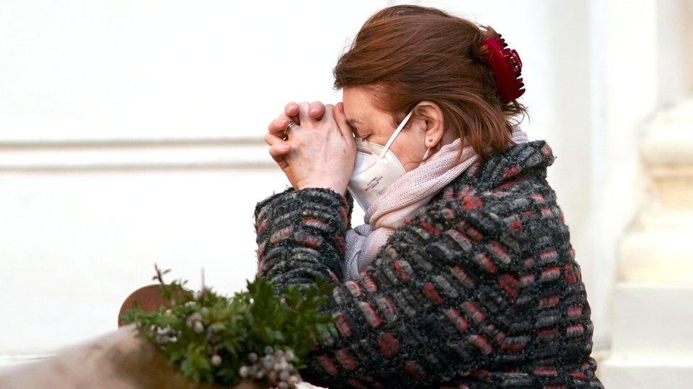 A worshipper attends a Palm Sunday mass, amid the coronavirus disease (COVID-19) outbreak, in Warsaw, Poland March 28, 2021