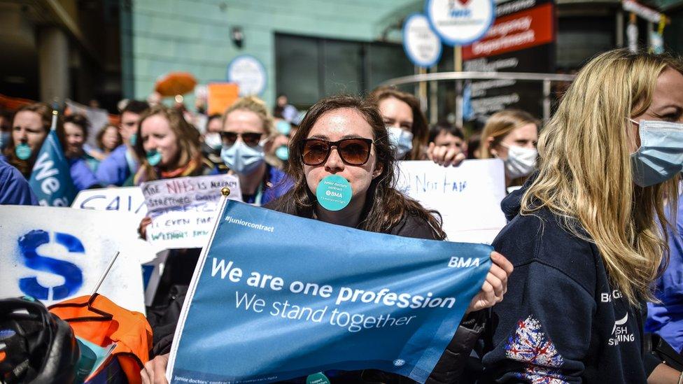 Junior doctors wearing masks in a silent protest