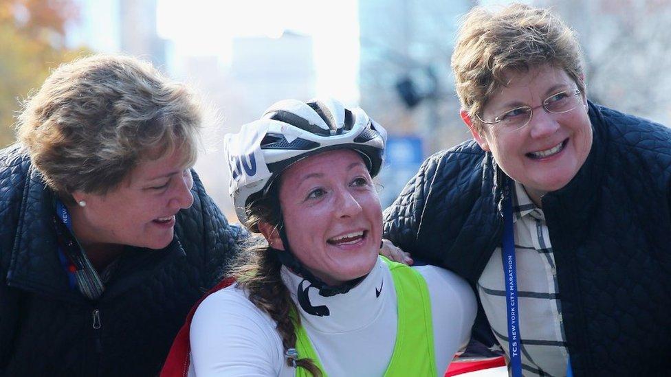 Tatyana with her adopted mothers Bridget O'Shaughnessey (R) and Debbie McFadden (L) after she won the New York City Marathon in 2016