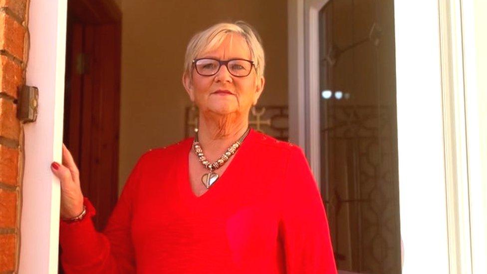 Barbara Galbraith struggles to walk up the steps to her apartment in Hunter's Hill in Downpatrick, County Down