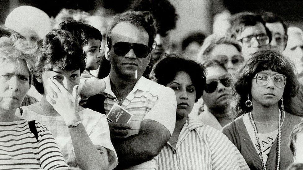 CANADA - JUNE 25: Time of grieve: These mourners were among more than 1;500 at Nathan Phillips Square yesterday for a memorial service for victims of the Air-India crash.