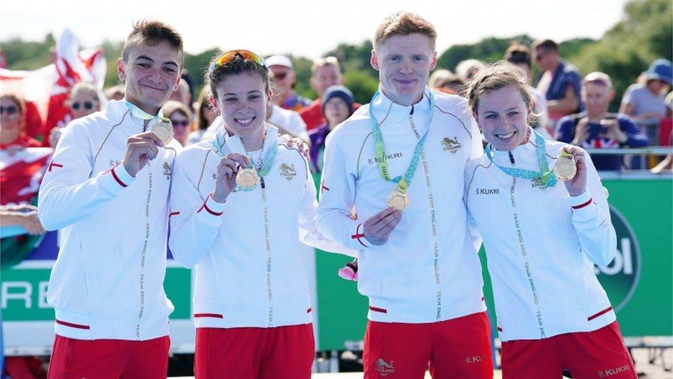 England's Alex Yee, Sophie Coldwell, Sam Dickinson and Georgia Taylor-Brown (left-right) celebrate winning gold in the mixed relay Triathlon on day three of the 2022 Commonwealth Games in Birmingham.