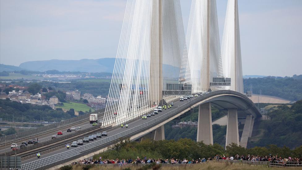 The hearse carrying the coffin of Queen Elizabeth crosses the Queensferry Crossing over the Firth of Forth