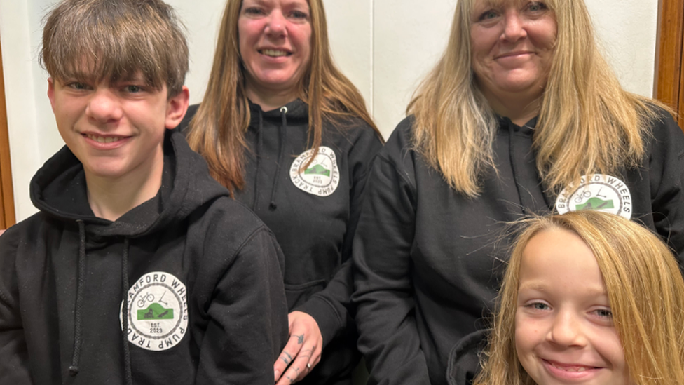 Harry with mum Amy, and Ollie with mum Toni