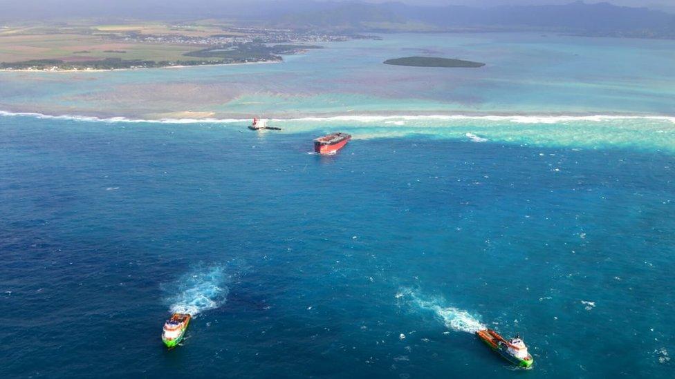 The bow of the MV Wakashio is being towed away