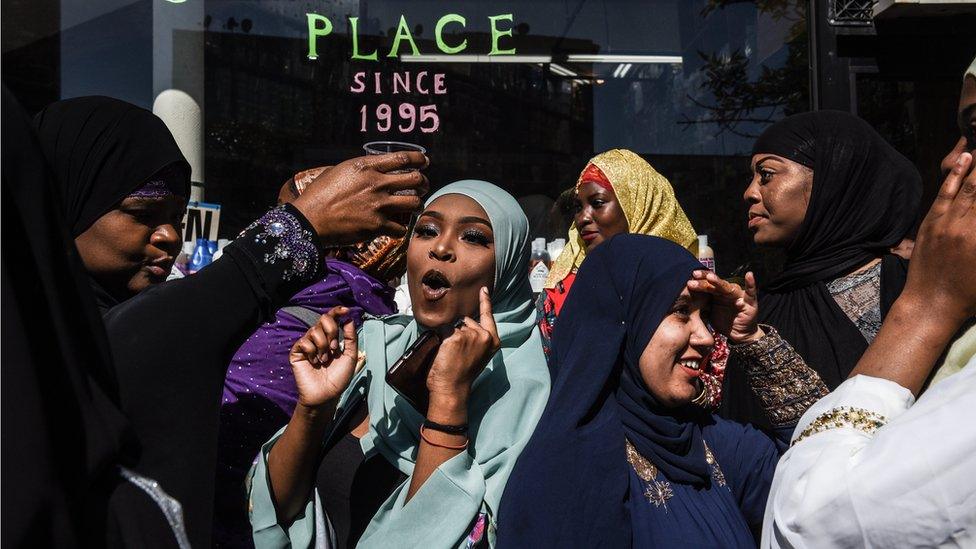 People celebrate at a mosque called the Masjid at-Taqwa after the Eid al-Fitr prayer on June 4, 2019 in the Brooklyn borough of New York City